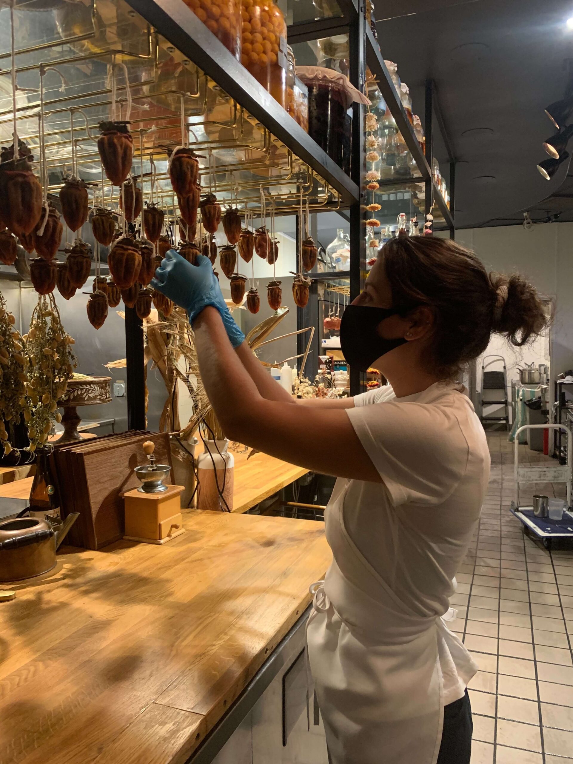 CASA student hanging pasta