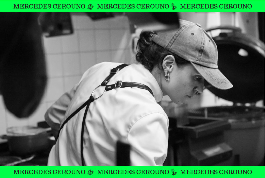 Black and white image of Mercedes Cerouno working in restaurant kitchen.