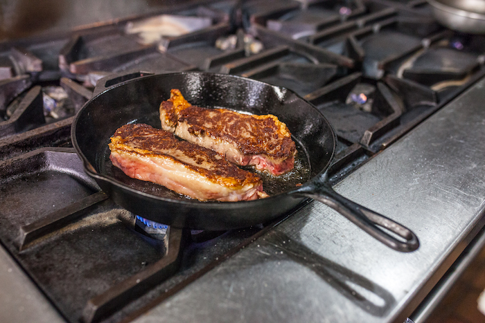 Two steaks in a cast iron pan