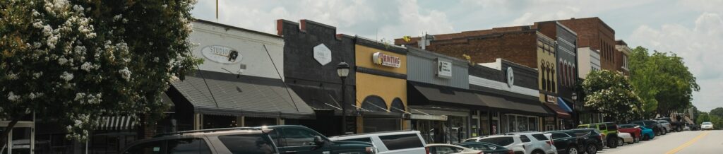 Image of a downtown street and shops to help illustrate culinary school in Decatur, GA.