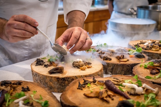 Pexels Elevate plating on cuts of logs with wild mushrooms