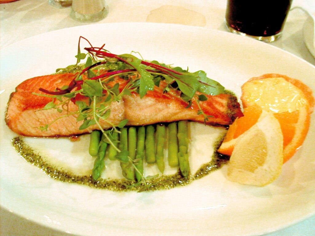 Salmon plated over asparagus