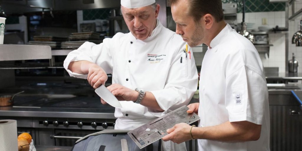 Chef demonstrating knife techniques